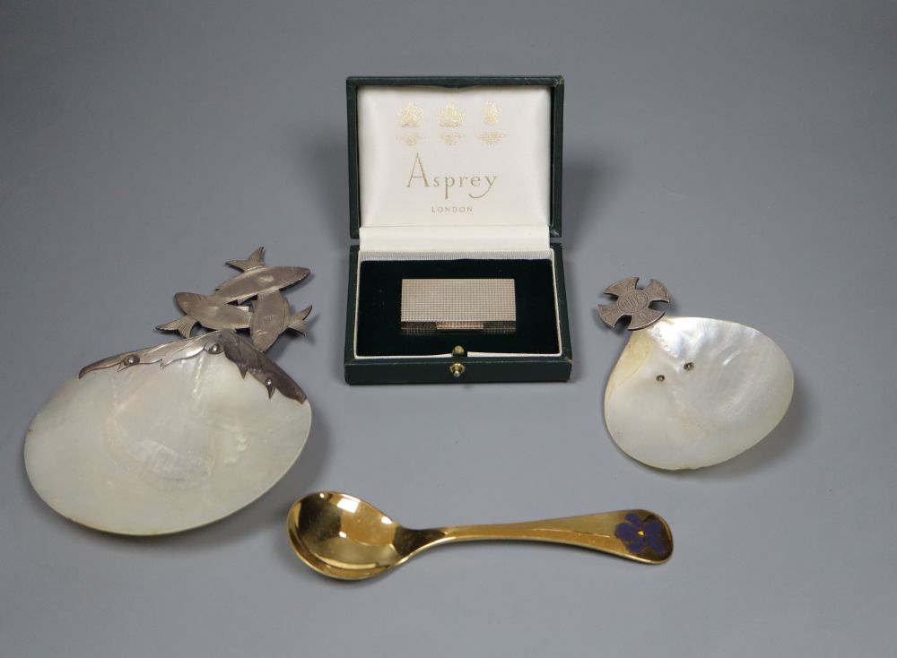 A modern cased Asprey & Co silver pill box, 51mm, a Jensen gilt sterling 1977 spoon and two servers.